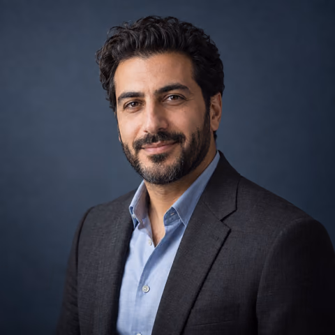 Illustrative AI portrait of a man in a charcoal blazer against a slate-blue backdrop; fictional person, not a customer result
