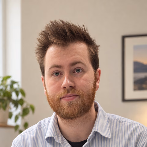 Carl’s actual AI-generated dating portrait in a striped shirt, shared with permission