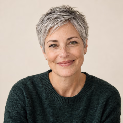 Illustrative AI portrait of a woman with short silver hair against a cream backdrop; fictional person, not a customer result