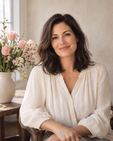 Illustrative AI portrait of a fictional adult woman beside spring flowers in soft window light