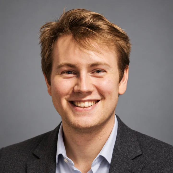 Carl’s AI-generated headshot: smiling in a charcoal blazer and open-collar shirt against a soft gray backdrop